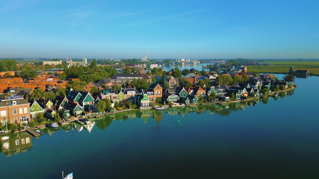 Old traditional wooden houses along the river at the Zaanse Schans, Netherlands