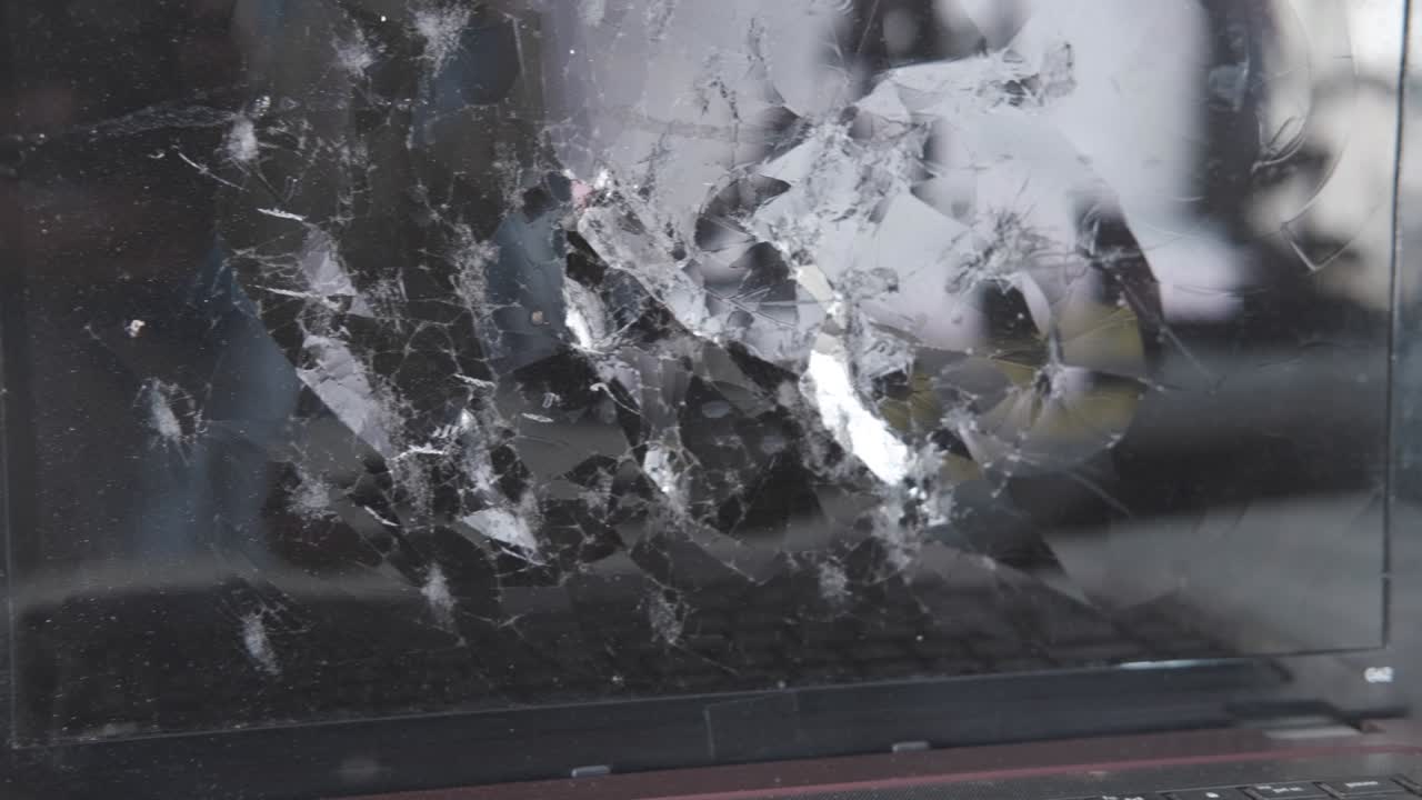 broken laptop screen on table close up