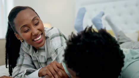 happy black couple, relax and lying on bed