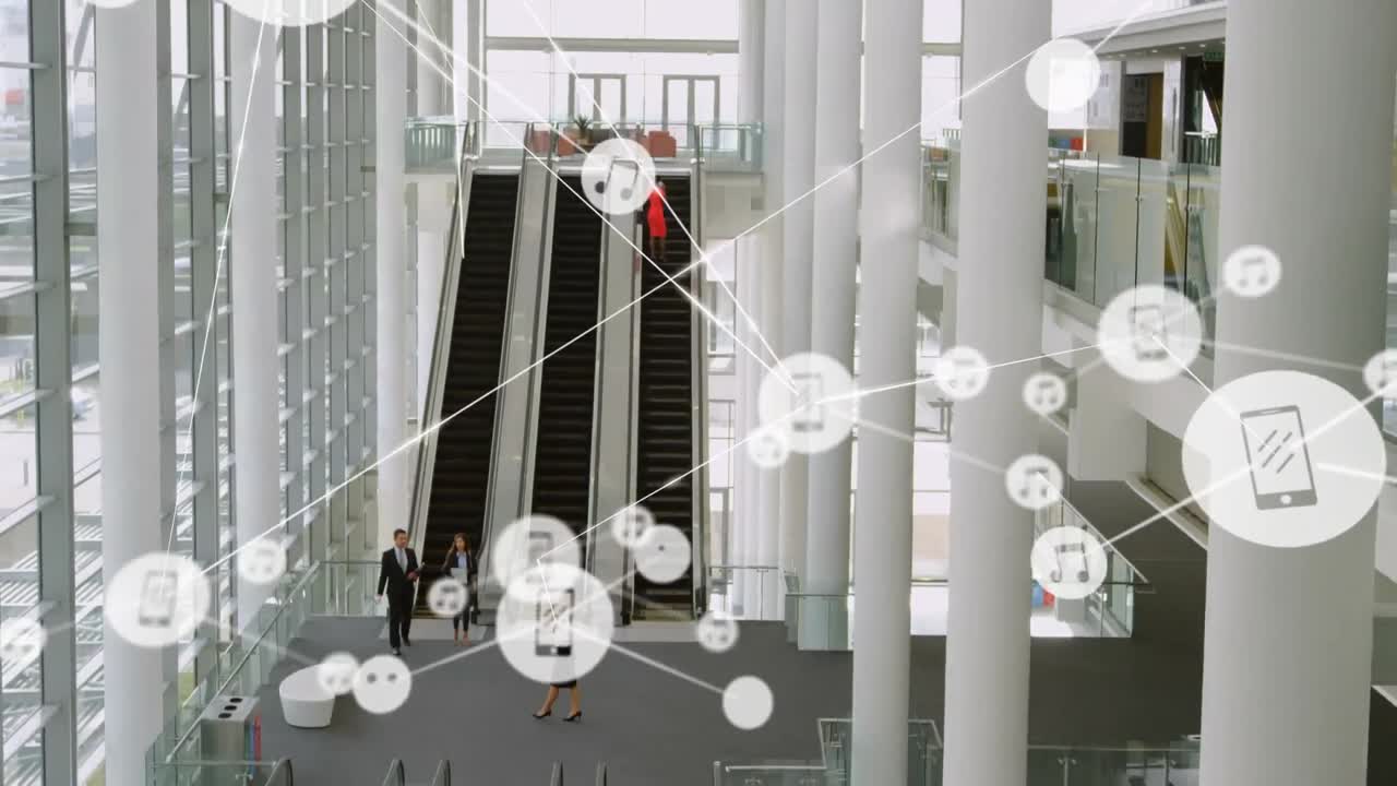 red de iconos digitales contra la vista desde arriba de la oficina moderna