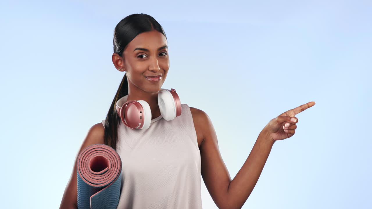 Headphones, pointing and woman face with fitness