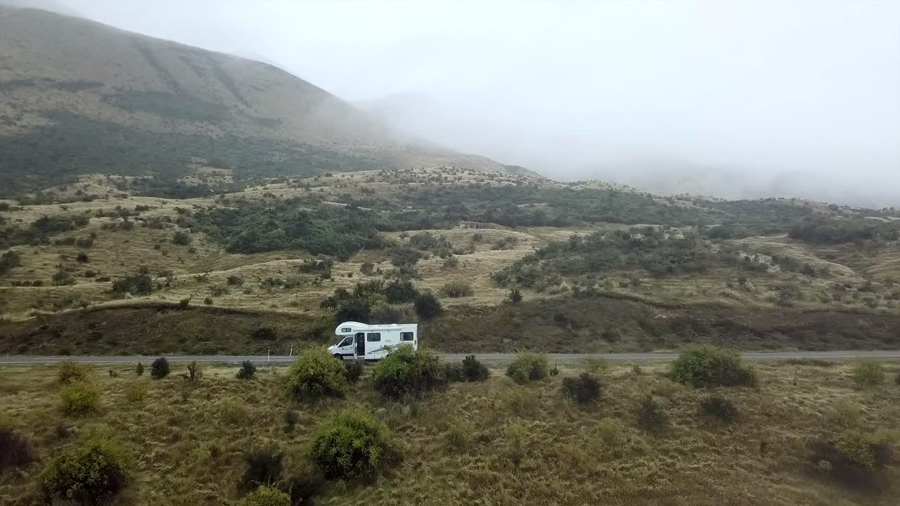 Motorhome on a road in a mountain landscape