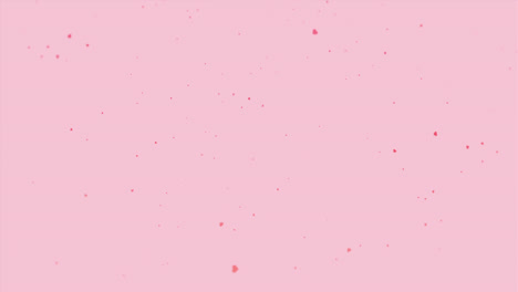 Pink-hearts-gently-falling-like-blossom-on-a-pale-pink-background