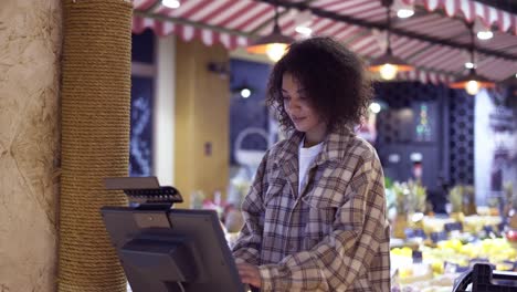 woman weighting banana fruits bio food in vegetable store or supermarket