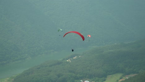 paraglider paragliding in danyang south korea 4k following shot