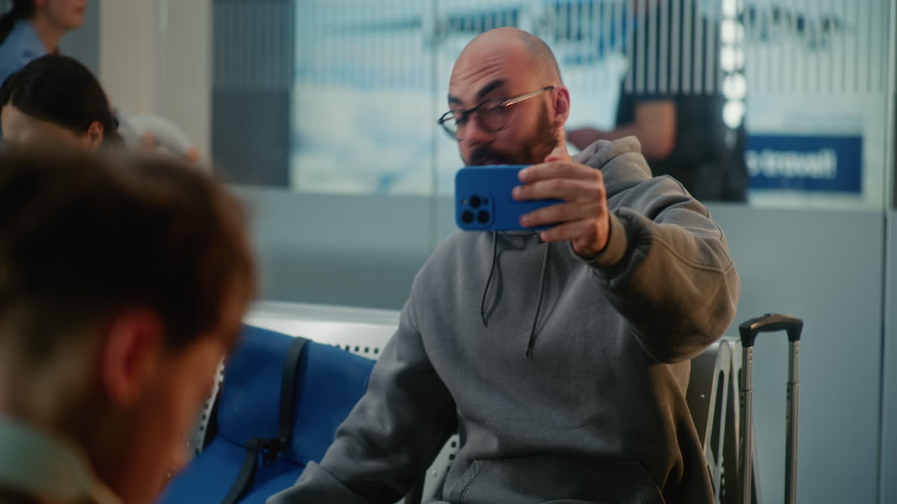 Man at Airport Taking a Video Call