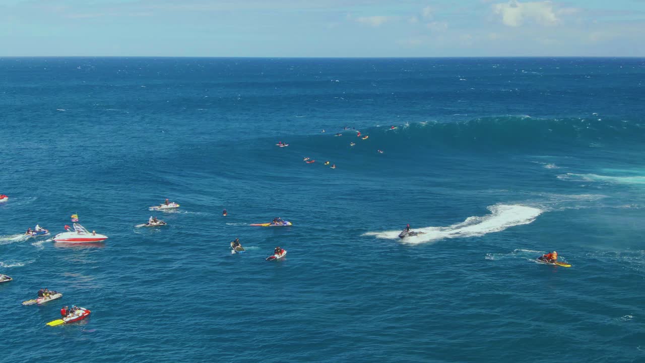 Young surfers compete for best performance on surfing through big waves of ocean in Hawaii