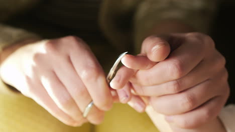 mom cuts nails on her daughter's hand close-up 4k video