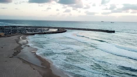 white water froth from incoming ocean tide, horizon and skyline backdrop
