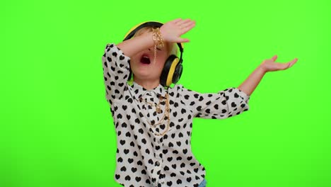 Cheerful-cute-blonde-child-kid-listening-music-via-headphones-dancing-disco-fooling-having-fun-party