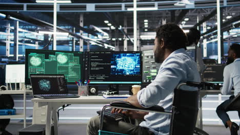 man with paraplegia in server hub trying to protect hardware from hacker attack