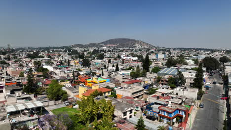 drone shot rising over shantytown in a poor district of sunny ciudad de méxico