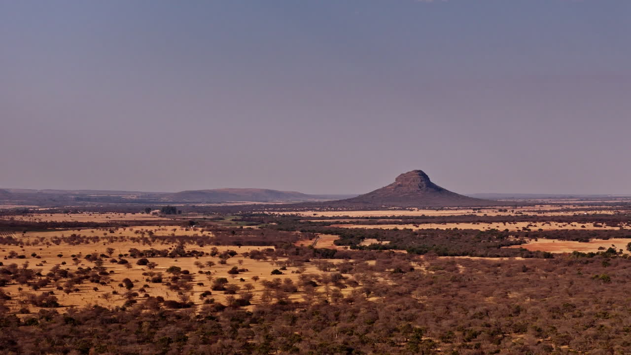 Solitary mountain in a vast open landscape - Drone 4K - perfect reference point for travellers