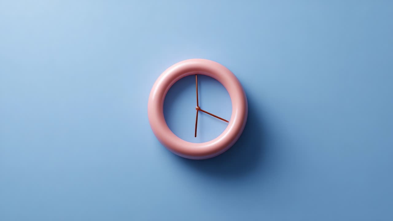 A Stylish Pink Circular Wall Clock Against a Soft Blue Background, Highlighting Modern Design and Minimalist Aesthetics in Interior Decoration and Timekeeping
