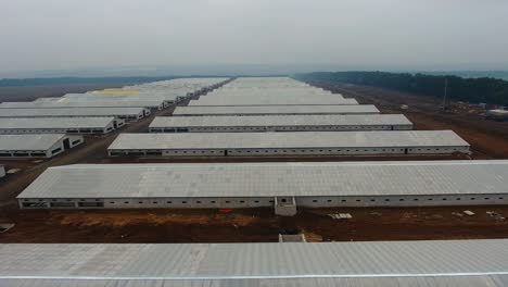 industrial farm building. top view of the newly built indusrial zone. aerial view of hangars in the factory. new modern hangars.