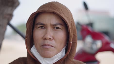 woman wearing hoodie and mask