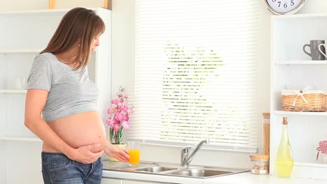 pregnant woman drinking juice