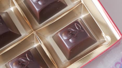 chocolate pralines in a box with elegant golden packaging for valentine's day
