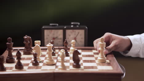 professional chess game with time clock in the background