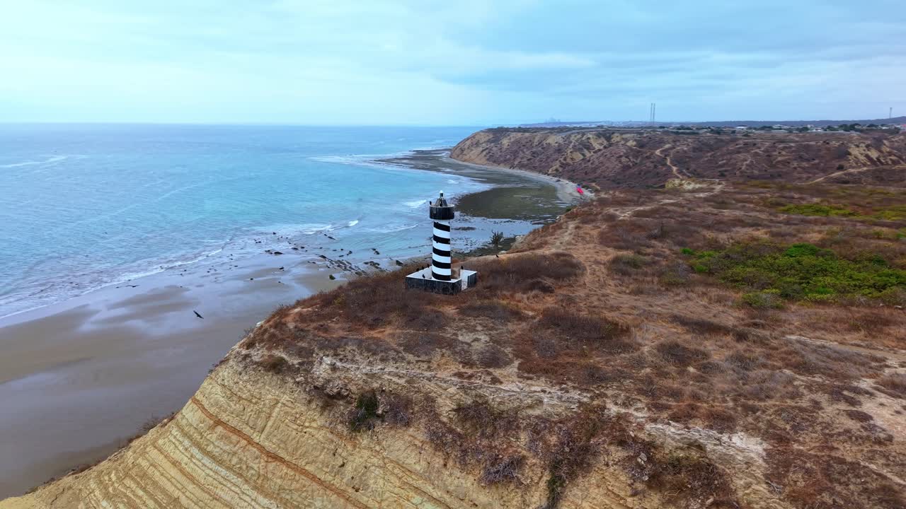 Scenic lighthouse on Ecuador's coast, near beach famous for kitesurfing