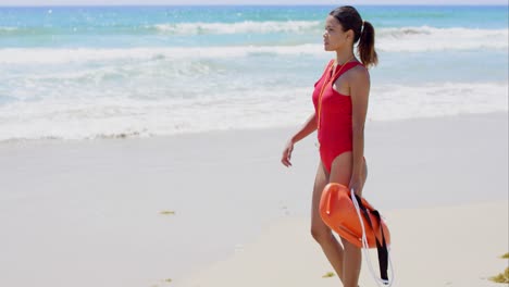 Side-view-on-woman-in-red-with-buoy