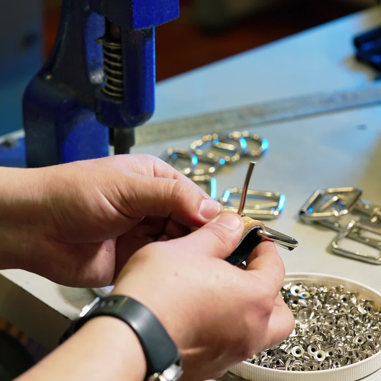 Tailor hands at work in fabric. Close up of work process of sewing machine in factory