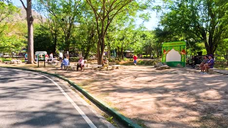 visitors enjoying a sunny day at the zoo