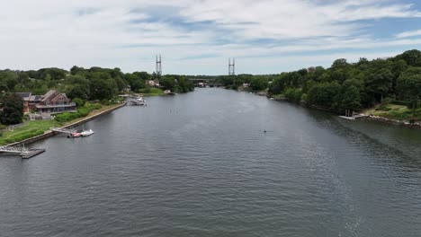 An-aerial-view-over-the-Saugatuck-River-in-Connecticut-on-a-beautiful-day-with-blue-skies-and-white-clouds