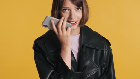 brunette woman sending voice mail