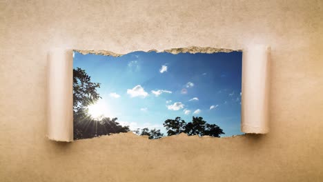 video creativo de 4k de nubes que se mueven rápidamente en el cielo azul al atardecer con llamaradas solares que son visibles a través de un agujero con bordes rasgados en viejo papel vintage retro grunge.