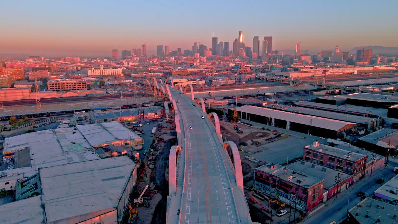 Downtown Los Angeles Arts District morning, slow drone descent over sixth street bridge
