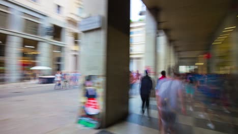 italy sunny milan city famous shopping street crowded rotating panorama 4k timelapse