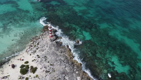 aerial high view of vintage lighthouse on caribbean sea coast in punta cancun, mexico