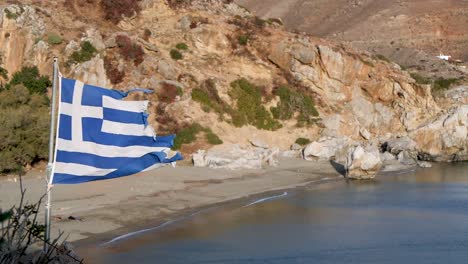 tattered greek flag blowing in the wind slow motion