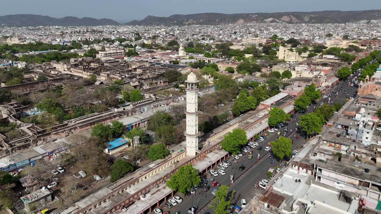 Aerial rotation drone shot of dense residential blocks in the heart of Jaipur.