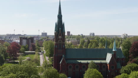 orbital shot of st matteus kyrka protestant church facade in norrköping sweden