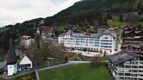 drone shot over wengen village in the bernese alps near lauterbrunnen in switzerland during spring