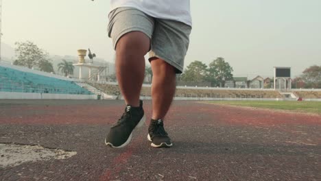 legs of far man running