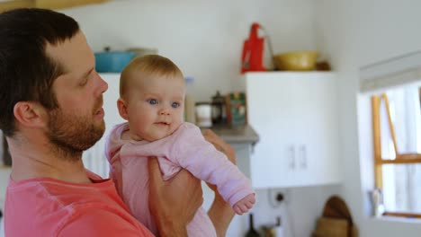 father holding his baby 4k