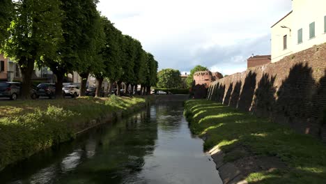 flying over the canal in soncino, cremona, lombardy, italy