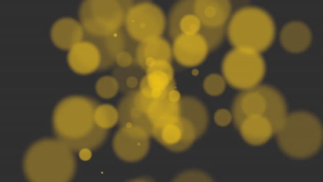 Glistening-yellow-circle-with-overlapping-circular-motifs-on-a-black-background