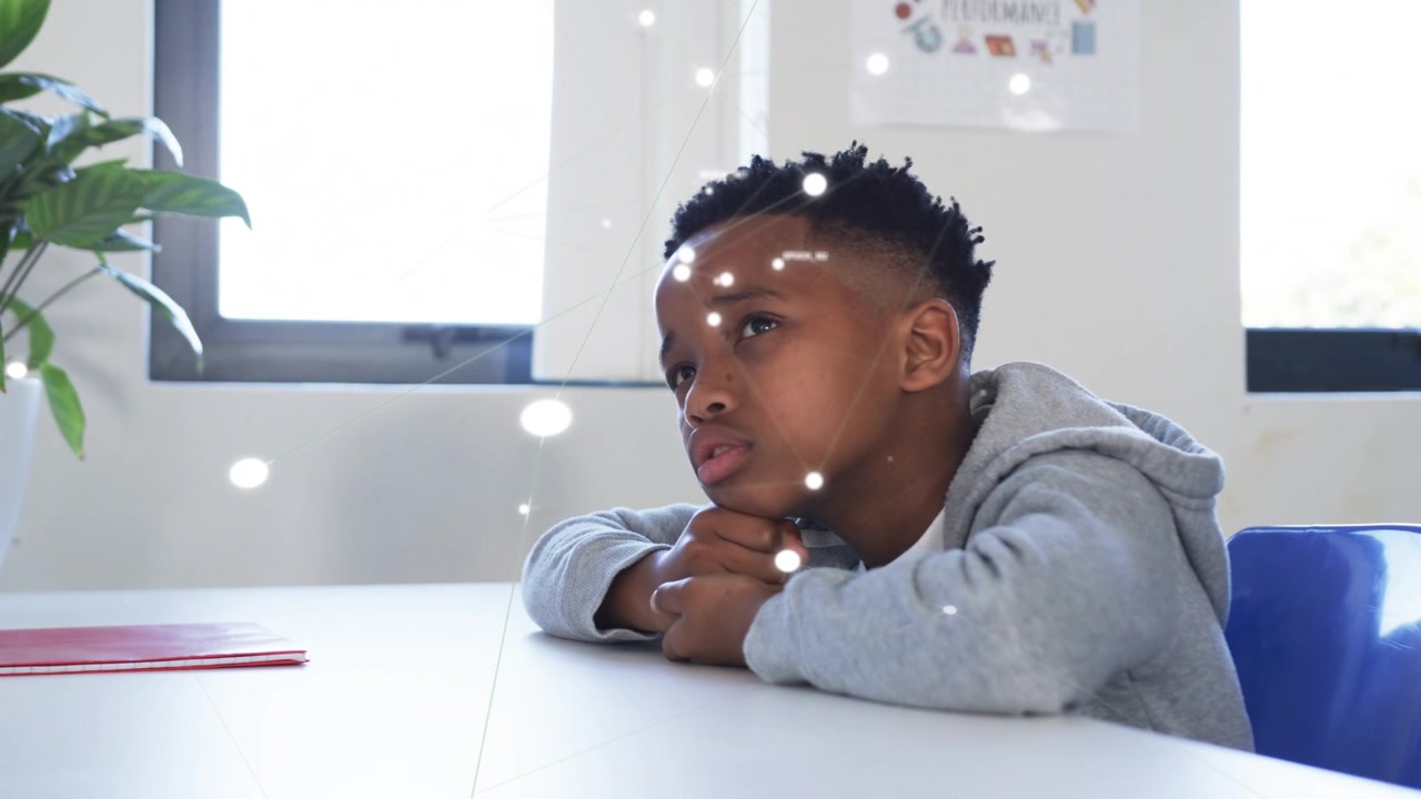 Male student tracking lights at white table in education, forming network overlay across foreground