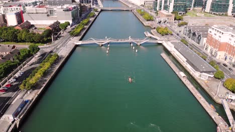 tourists watching paddle boat from the seán o'casey bridge