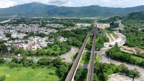 Ferrocarril-Mtr-De-Hong-Kong-En-Las-Afueras-De-La-Ciudad,-Vista-Aérea