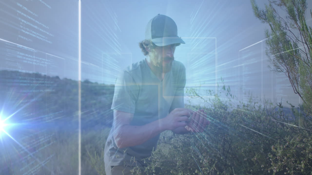 Man crouching among dry shrubs, inspecting plant health with floating tech overlays plus lens flare