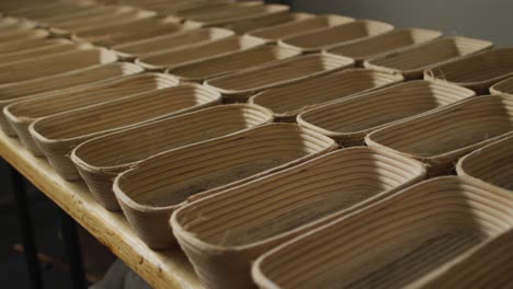 animation of rows with bred molds preparing for use in bakery