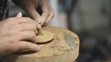 potter works with clay