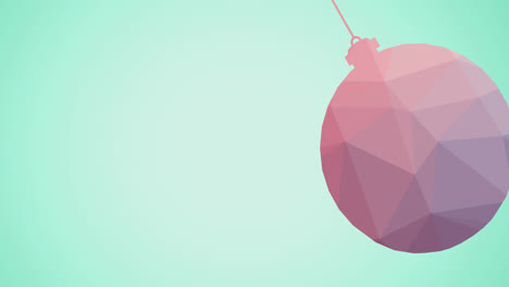 animation of pink christmas bauble over green background