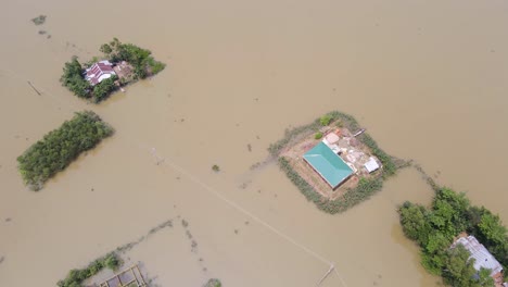 bird’s-eye view of flood disaster with submerged homes and surrounding land at a village in bangladesh, south asia