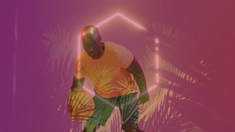 animación de patrón de neón y hojas sobre jugador de baloncesto afroamericano.